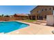 Backyard oasis with a refreshing blue swimming pool and outdoor patio at 11836 W Planada Ct, Sun City, AZ 85373