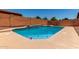 Inviting in-ground pool with clear blue water and tiled trim, perfect for relaxation and fun in the sun at 11836 W Planada Ct, Sun City, AZ 85373