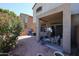 Private backyard featuring a covered patio and desert landscaping at 1350 S Greenfield Rd # 1130, Mesa, AZ 85206