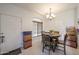 Bright dining room with tile floors, a round wood table, and a chandelier at 1350 S Greenfield Rd # 1130, Mesa, AZ 85206