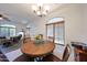 Bright eat-in kitchen with tile flooring, natural light, and views to living area at 1350 S Greenfield Rd # 1130, Mesa, AZ 85206