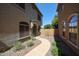 Charming townhome with desert landscaping and a quaint front walkway at 1350 S Greenfield Rd # 1130, Mesa, AZ 85206
