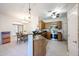 Open-concept kitchen with tile floors, stainless steel appliances, and a breakfast bar at 1350 S Greenfield Rd # 1130, Mesa, AZ 85206