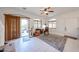 Sunlit living room with tile floors, ceiling fan, and access to the outdoor patio at 1350 S Greenfield Rd # 1130, Mesa, AZ 85206