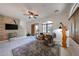 Spacious living room featuring tile floors, a ceiling fan, and natural light at 1350 S Greenfield Rd # 1130, Mesa, AZ 85206