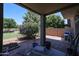 A covered patio overlooking a backyard featuring desert landscaping at 1350 S Greenfield Rd # 1130, Mesa, AZ 85206