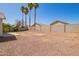 View of gravel backyard featuring block fence and desert landscaping at 15440 W Mauna Loa Ln, Surprise, AZ 85379