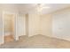 Inviting bedroom with neutral walls, carpet, and convenient access to an attached bathroom at 15440 W Mauna Loa Ln, Surprise, AZ 85379