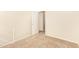 Bright bedroom with neutral walls, carpet, and a convenient doorway at 15440 W Mauna Loa Ln, Surprise, AZ 85379