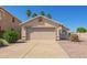 Attractive single-story home with a well-maintained yard and a spacious two-car garage at 15440 W Mauna Loa Ln, Surprise, AZ 85379