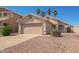 Cozy single-story home with a convenient two-car garage and low-maintenance landscaping at 15440 W Mauna Loa Ln, Surprise, AZ 85379