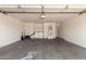 Spacious garage with laundry area, ample storage, and a utility sink at 15440 W Mauna Loa Ln, Surprise, AZ 85379