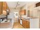 Functional kitchen featuring wooden cabinets, ample counter space, and standard appliances at 15440 W Mauna Loa Ln, Surprise, AZ 85379
