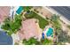Aerial view featuring a backyard oasis with a pool, lounge area, and beautifully landscaped yard at 1571 E Saratoga Ct, Gilbert, AZ 85296