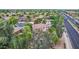 Aerial view of a home with lush trees and landscaping, featuring a serene backyard pool area at 1571 E Saratoga Ct, Gilbert, AZ 85296