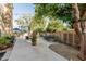 Spacious backyard patio with potted plants, seating, and a convenient bicycle storage area at 1571 E Saratoga Ct, Gilbert, AZ 85296