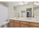 Bathroom vanity featuring dual sinks, a large mirror and ample storage at 1571 E Saratoga Ct, Gilbert, AZ 85296