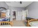 Spacious bedroom includes desk, keyboard, closet, and an adjacent twin bedroom at 1571 E Saratoga Ct, Gilbert, AZ 85296