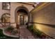 Close up of the welcoming entrance to this home with stone walkway and flower planters at 1571 E Saratoga Ct, Gilbert, AZ 85296