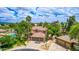 Charming home with a tile roof, three-car garage, pool, and lush landscaping in a desirable location at 1571 E Saratoga Ct, Gilbert, AZ 85296