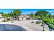 Overhead shot of the horse barn and stalls with mature desert landscaping and paved walkway at 1571 E Saratoga Ct, Gilbert, AZ 85296