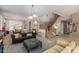 Spacious living area showcases staircase, piano, and dining area, perfect for entertaining guests at 1571 E Saratoga Ct, Gilbert, AZ 85296