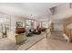 Open concept living space featuring multiple seating areas, a dining area, and a staircase at 1571 E Saratoga Ct, Gilbert, AZ 85296