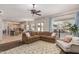 Spacious living room with an open layout connecting to the kitchen, and lots of natural light at 1571 E Saratoga Ct, Gilbert, AZ 85296