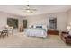 The neutral main bedroom boasts great natural light and comfortable furniture at 1571 E Saratoga Ct, Gilbert, AZ 85296