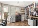 Home office with built-in shelving, natural light, and ample storage at 1571 E Saratoga Ct, Gilbert, AZ 85296