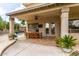 Covered patio featuring outdoor dining area, a ceiling fan, and french doors to the inside at 1571 E Saratoga Ct, Gilbert, AZ 85296