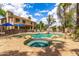 Inviting pool area features a rock-accented pool, hot tub, and ample space for relaxation at 1571 E Saratoga Ct, Gilbert, AZ 85296