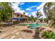 Beautiful backyard oasis with a sparkling pool, spa, lush landscaping, and plenty of space to enjoy at 1571 E Saratoga Ct, Gilbert, AZ 85296