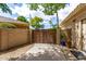 Side yard access with a well-maintained block wall and gravel, showcasing outdoor privacy at 1571 E Saratoga Ct, Gilbert, AZ 85296