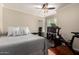 Bedroom with a ceiling fan, wood floors, an exercise bike, a television, and sliding closet doors at 1630 W Calle Del Norte --, Chandler, AZ 85224