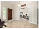 Inviting foyer featuring tile flooring, a solid wood front door, and an arched entryway, setting a welcoming tone at 1630 W Calle Del Norte --, Chandler, AZ 85224