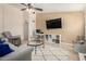 Inviting living room with a comfortable chair and sofa, complemented by natural light and modern decor, ideal for relaxation at 1630 W Calle Del Norte --, Chandler, AZ 85224