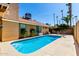 Private backyard pool featuring a well-maintained patio, mature landscaping, and a charming exterior elevation at 1630 W Calle Del Norte --, Chandler, AZ 85224