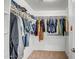 Spacious walk-in closet with ample shelving and hanging space for clothing and accessories at 17802 N 114Th Ln, Surprise, AZ 85378