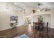 Open-concept dining area with high ceilings, an elegant chandelier, and staircase access at 18030 W Caribbean Ln, Surprise, AZ 85388