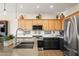 Bright and airy kitchen with stainless steel appliances and stylish pendant lighting at 18030 W Caribbean Ln, Surprise, AZ 85388