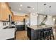Well-appointed kitchen featuring a breakfast bar, modern appliances, and ample counter space at 18030 W Caribbean Ln, Surprise, AZ 85388
