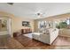 Comfortable living room with a plush sofa, and large windows providing natural light at 18030 W Caribbean Ln, Surprise, AZ 85388