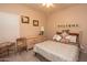 Cozy bedroom features light walls, ceiling fan, and wooden furniture at 18198 E El Viejo Desierto --, Gold Canyon, AZ 85118