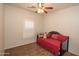 Neutral bedroom with tile flooring, shuttered window, and a comfortable daybed at 18198 E El Viejo Desierto --, Gold Canyon, AZ 85118