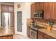 Modern kitchen featuring stainless steel appliances, granite countertops, and a pantry at 18198 E El Viejo Desierto --, Gold Canyon, AZ 85118
