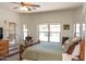 Comfortable bedroom with a ceiling fan, neutral walls, and a view of the backyard at 18198 E El Viejo Desierto --, Gold Canyon, AZ 85118