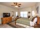 Cozy main bedroom with natural light, a ceiling fan, and a view of the backyard at 18198 E El Viejo Desierto --, Gold Canyon, AZ 85118
