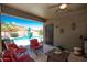 Covered patio with red seating overlooking sparkling pool and blue skies at 18198 E El Viejo Desierto --, Gold Canyon, AZ 85118