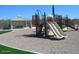 Community playground with slides, climbing structures, and a covered pavilion for shade at 18198 E El Viejo Desierto --, Gold Canyon, AZ 85118